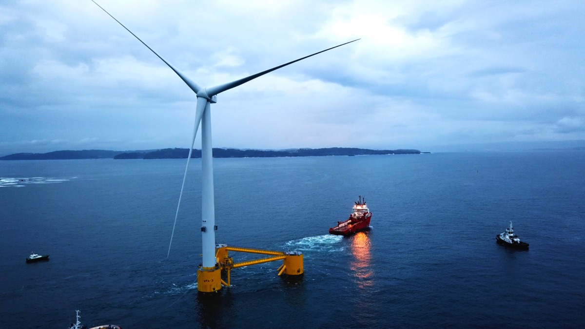 Floating wind turbine being towed