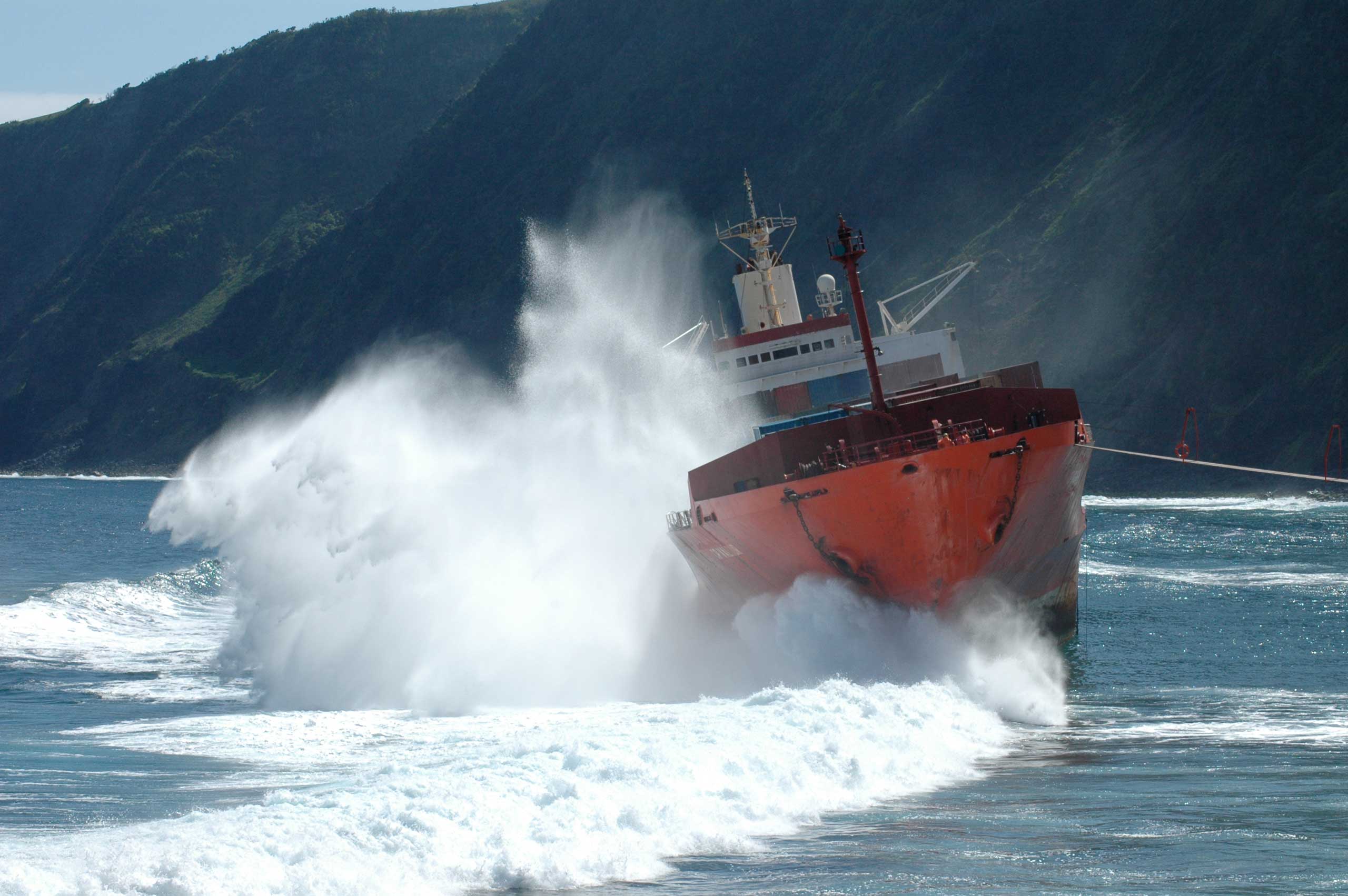 Ship battered by waves